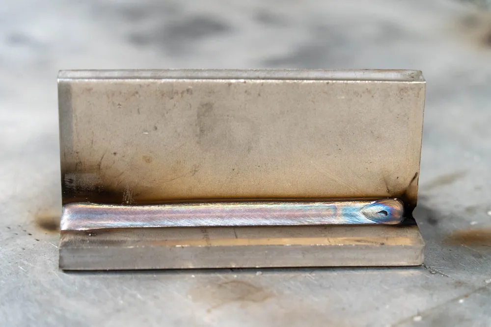 Carbon steel weld sample used to review spatter, cleanup and bead appearance.