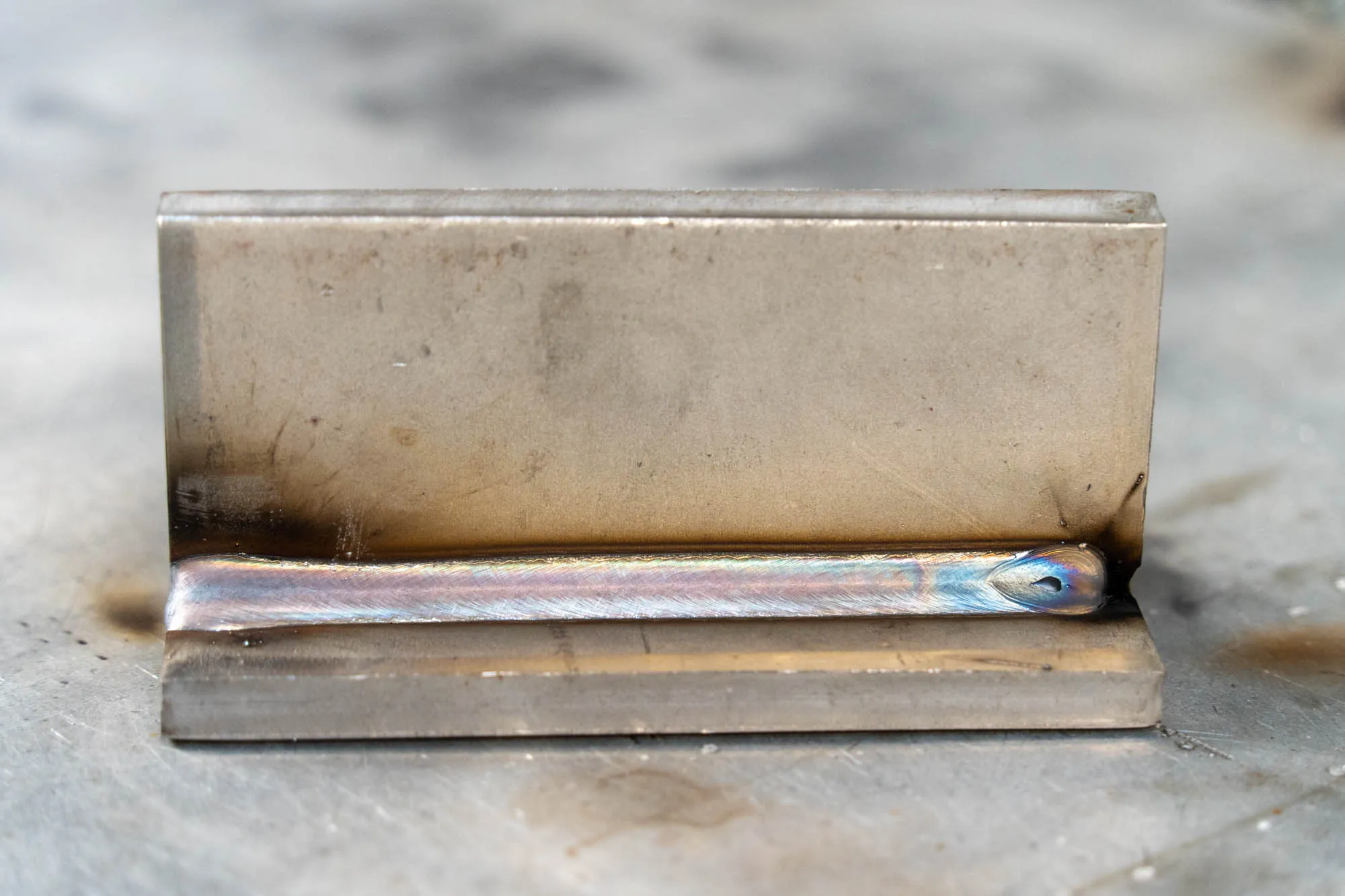 Carbon steel weld sample used to review spatter, cleanup and bead appearance.