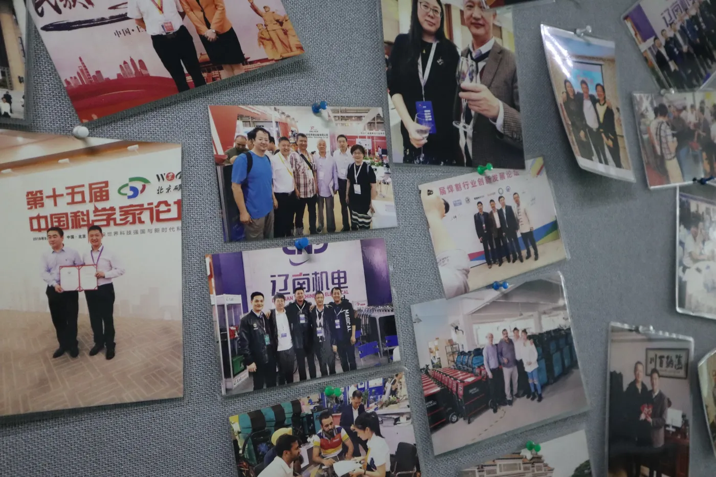 Photo wall showing Deyun and Kingree industry events, customer visits and welding exhibitions