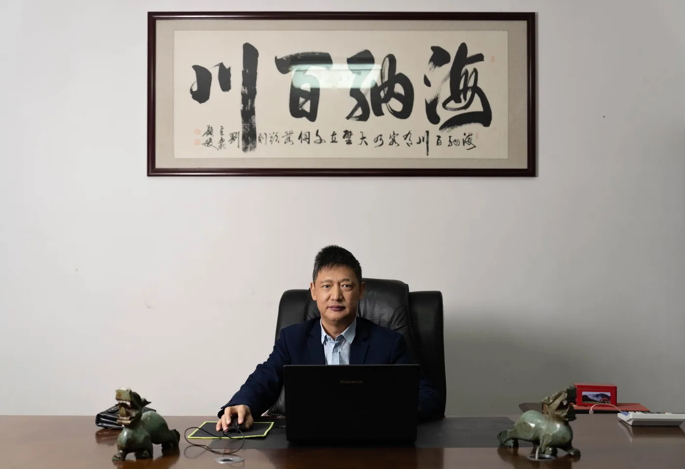 Mr. Zhao, CEO of Deyun, seated in his office