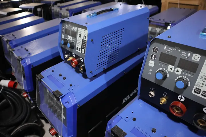 Blue welding machines and front panels staged together