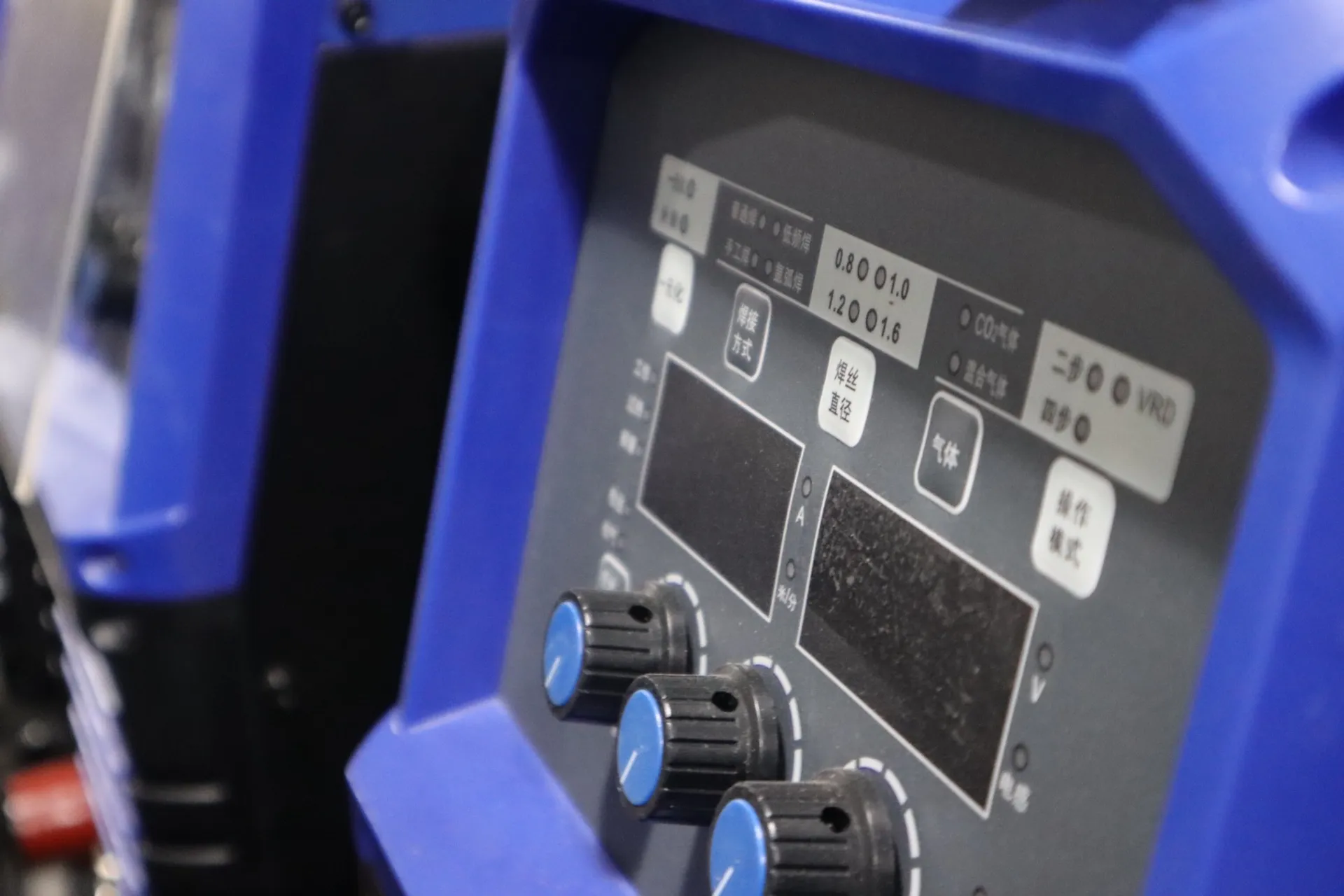 Close-up of a welding machine control panel for checking input power and setup requirements.