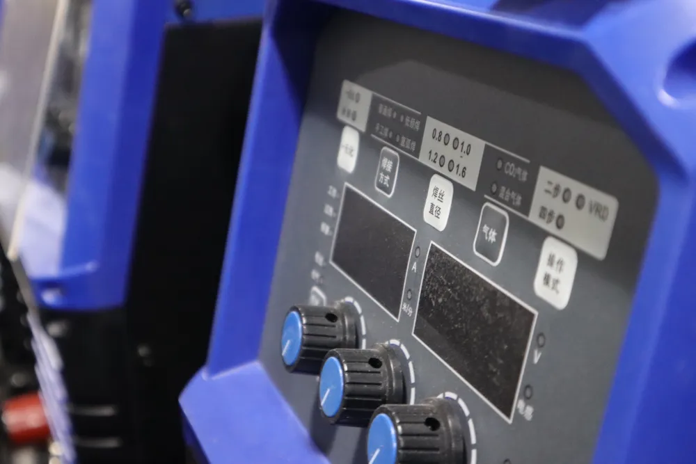 Close-up of a welding machine control panel for checking input power and setup requirements.