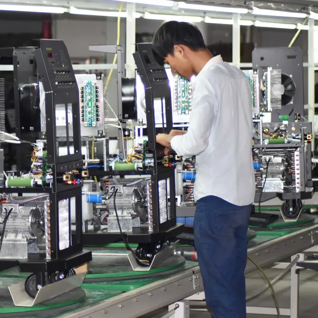 Technician assembling a Deyun welding machine on the factory line